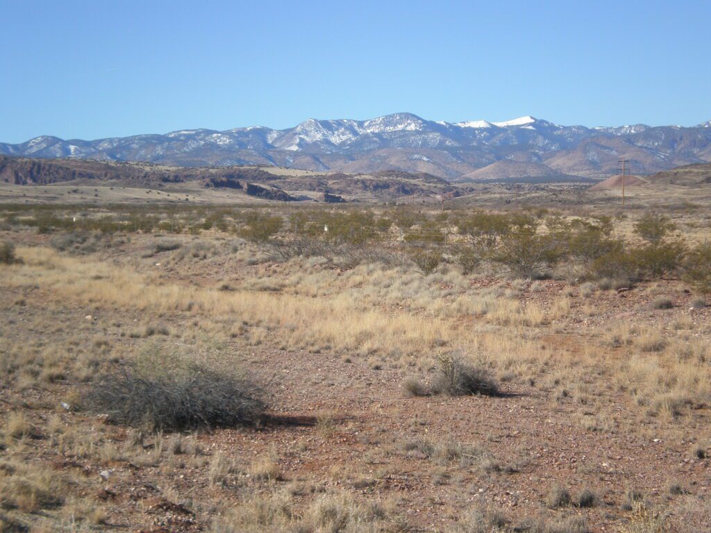 Looking west, from the north side US Route 60, at the Magdalena Mountains west of Socorro, NM. South Baldy is the snowcapped mountain peak seen in the distance to right center. Pho