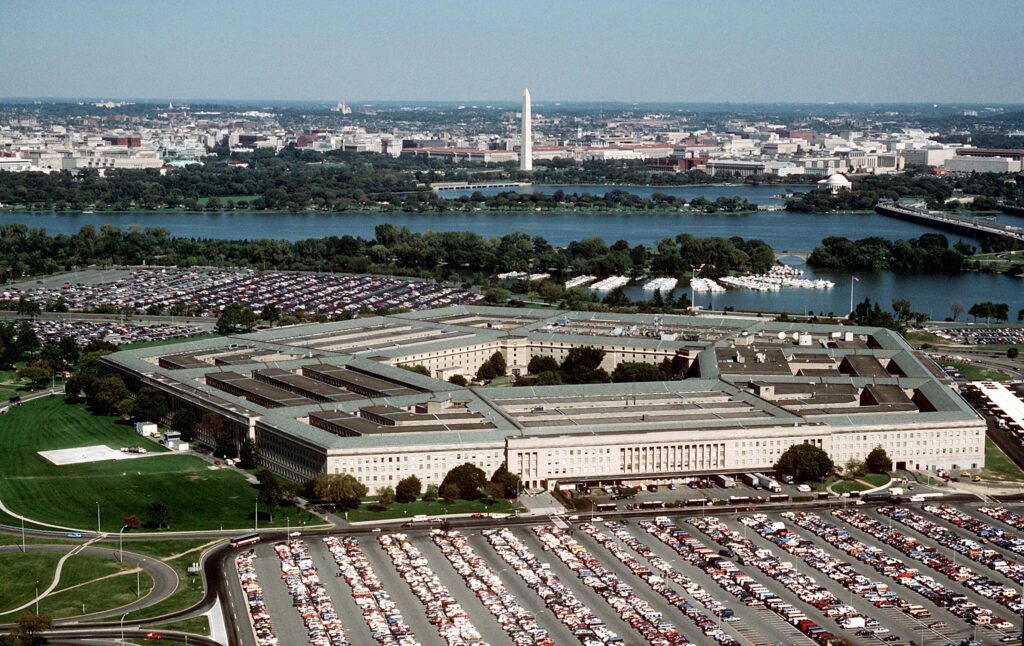 The Pentagon , looking northeast with the Potomac River and Washington Monument in the distance. The Tidal Basin is seen just below the Washington Monument. The marina which is vis