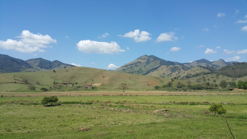 Countryside view of Gonçalves municipality with mountains on the background. Seen next to MG-173 highway in Minas Gerais, Brazil.